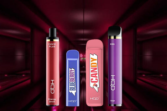 HQD disposable vape review - All devices: Cuvie Plus, Cuvie V1, HQD MEGA, and HQD King with futuristic looking red background.